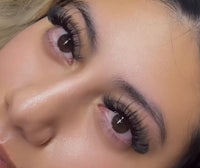 a woman with long lashes and a close up of her face